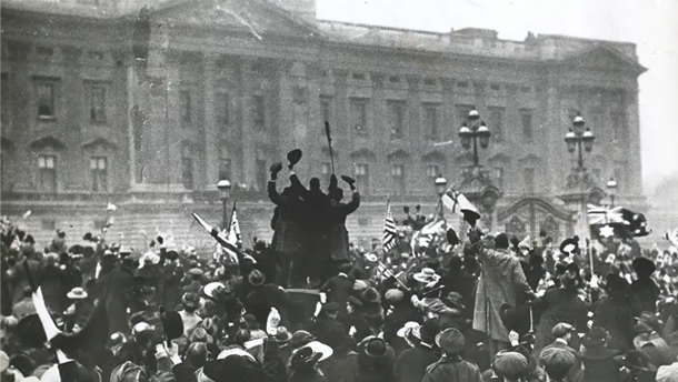 A crowd celebrates the end of WWI