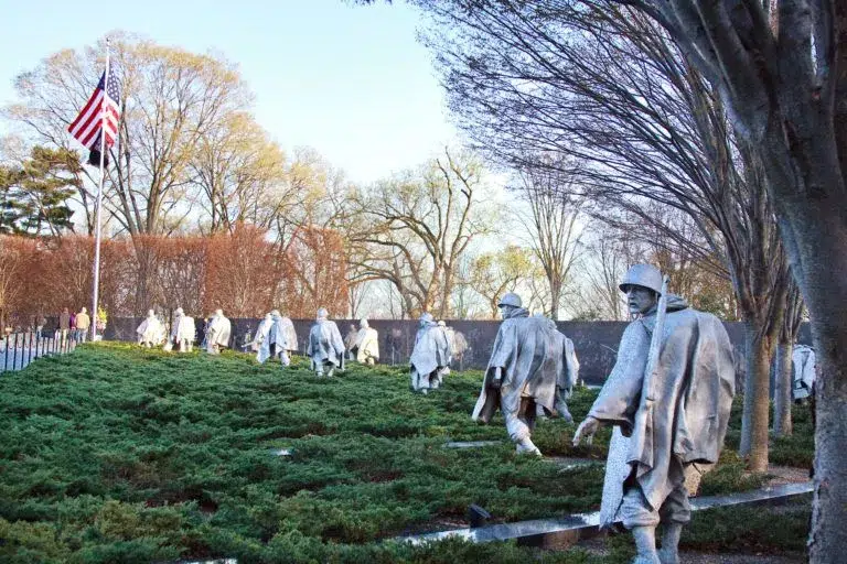 The Korean War Memorial showing statues representing soldiers on patrol facing an American flag