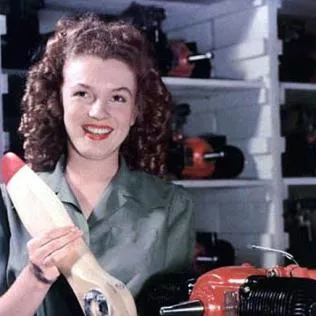 Norma Jeane Dougherty holding a propeller for a WWII Radioplane drone